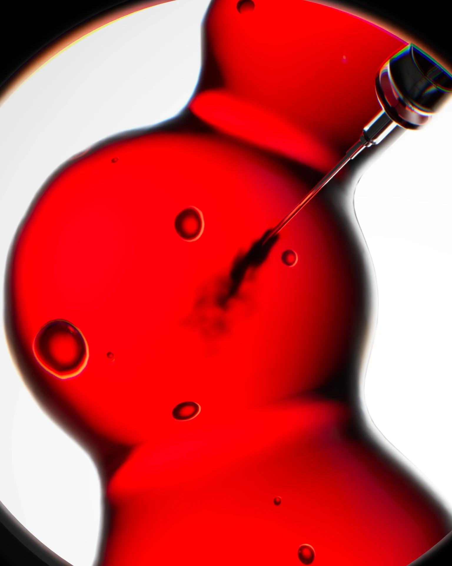 Red translucent organic form with suspended bubbles