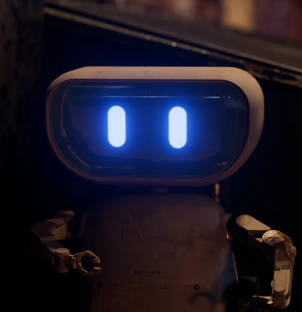 Small robot with a glowing blue face