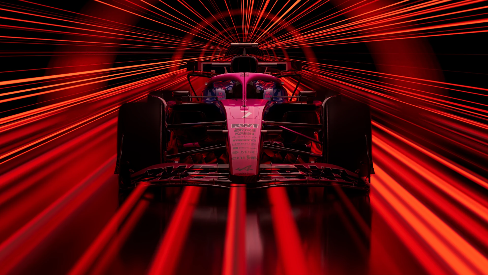 Front view of a Formula 1 car surrounded by red light