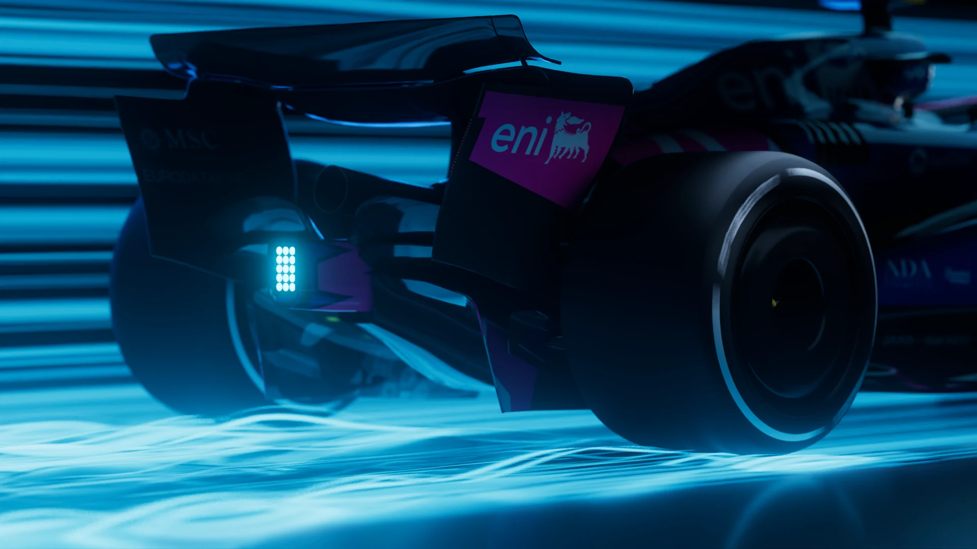 Rear wheel of a Formula 1 car in blue light
